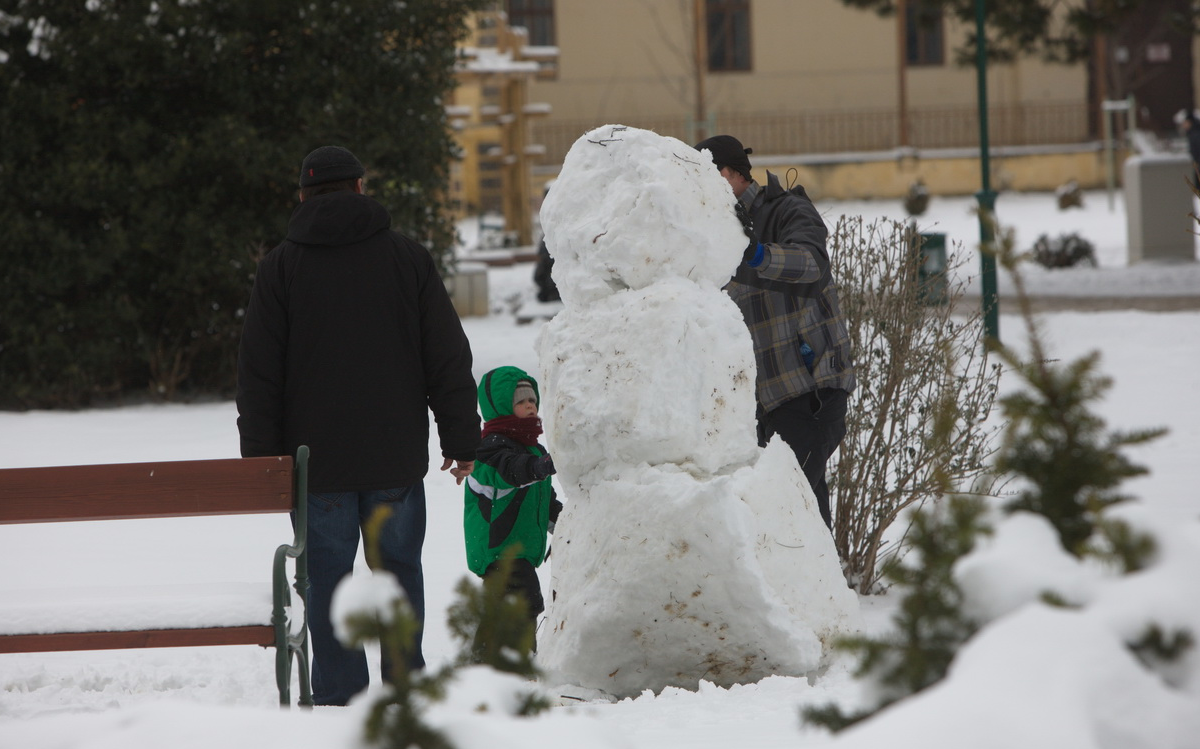 Building a snowman at the Balaton shore in wintern