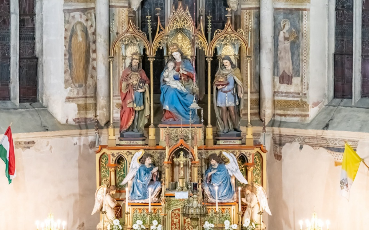 The altar and Gothic frescoes of the church